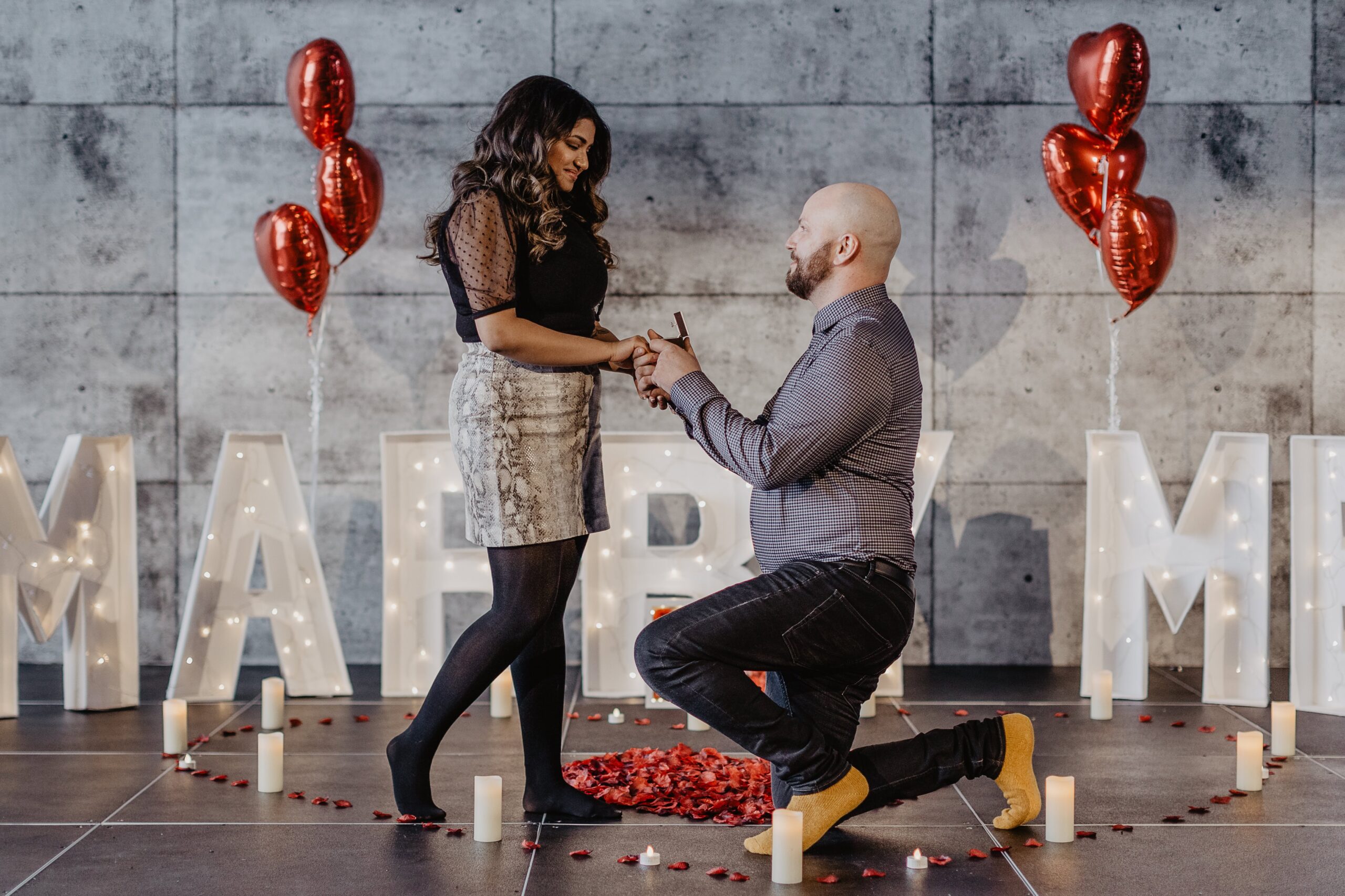 Surprise Proposal in Edmonton- Engagement ring in hand during emotional Edmonton proposal
