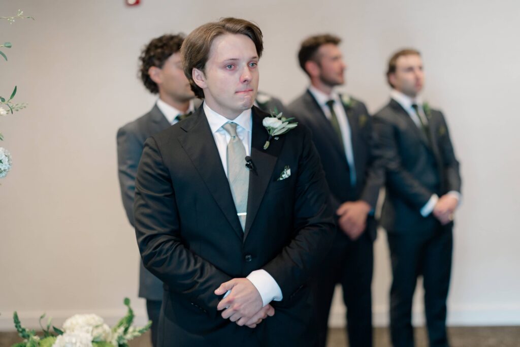 Moment Cole saw Sofie on their wedding day - Royal Glenora Club wedding photos in Edmonton -Timeless Tales Creatives