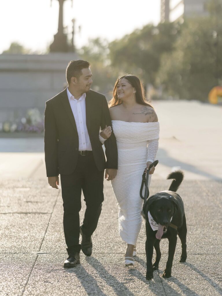 Edmonton Legislature Engagement Photo Session: A Complete Guide To Edmonton'S Most Iconic Location Sunset Edmonton legislature engagement photos of the couple with their dog.