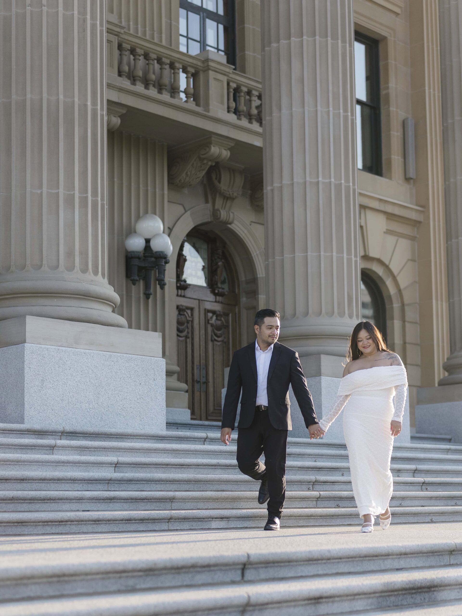 Edmonton Legislature Engagement Photo Session - Timeless Tales Creatives - Couple on steps walking